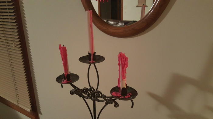 If you're afraid to light candles when you have a large party, pre-light the bleeding candles so the wax drips down and gives the cool appearance of bleeding candles