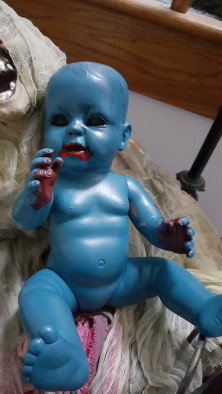 I ran out of white paint to make this doll more grey/blue...and he turned into a creepy blue zombie baby