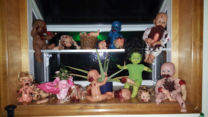 A scene of creepy cannibal baby dolls and bloody doll parts