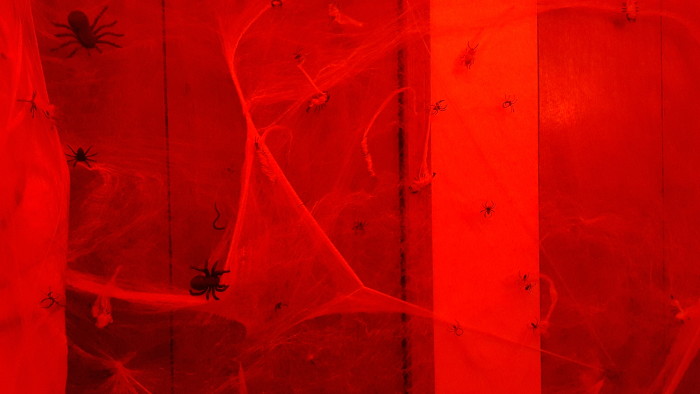 Use red lighting to increase the scare factor in your bathroom spider den